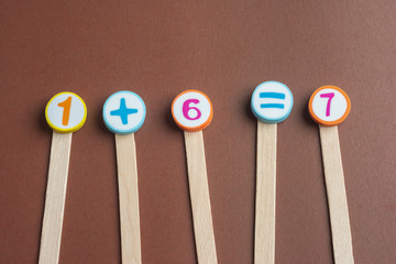 mathematics Toy Numbers on Brown Background.