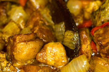 Roast meat, onions, carrots and spices, boiling in oil