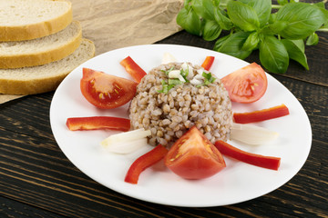 Buckwheat Porridge on Rustic Background Close Up