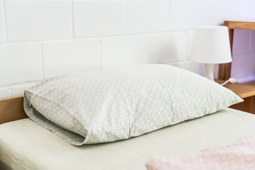 Fototapeta na wymiar Comfortable pillow on bed decoration