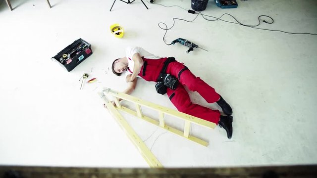 Top view of an accident of a man worker at the construction site.