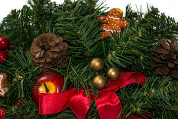 Close up christmas tree wreath decoration isolated on white background. Christmas and New year symbols, decoration, concept. Gingerbread star, tree, man. Winter holidays. Christmas flat lay.