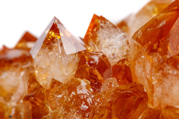 Macro mineral stone Citrine in rock in crystals on a white background