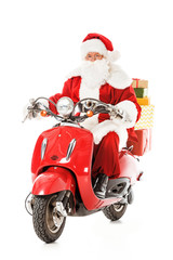 santa claus riding vintage red scooter and looking at camera isolated on white