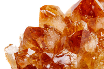Macro mineral stone Citrine in rock in crystals on a white background
