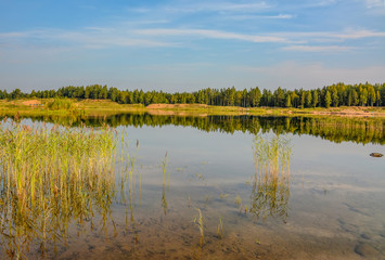 Artificial lake formed after the removal of sand. Closed sand quarry.