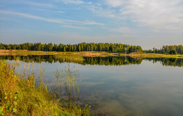 Artificial lake formed after the removal of sand. Closed sand quarry.