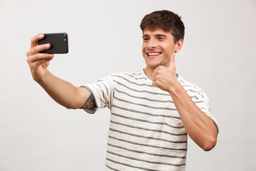 Portrait of a cheerful young man standing