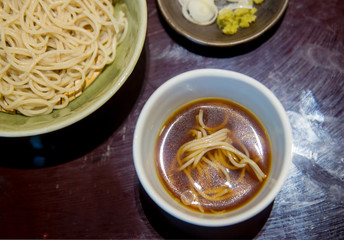 Close up soba noodles, placed on Bamboo grill on bowl. Asia traditional food.image for background, wallpaper and copy space.