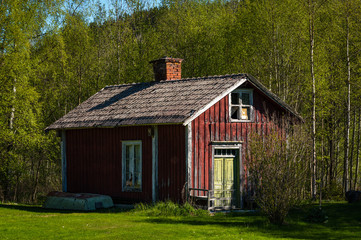 Old red and white house falling apart