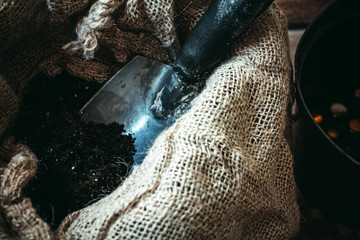Black soil and shovel for gardening