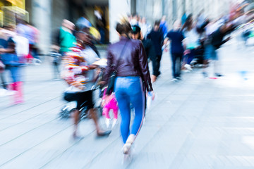 creative zoom picture of people walking in the city