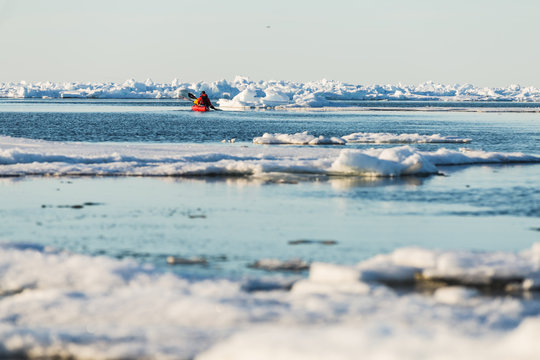 Kayakers enjoying an evening paddle on the Arctic Ocean
