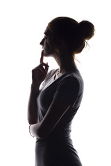 profile of beautiful girl with hand-picked hair, silhouette of a woman on a white isolated background