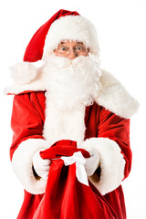 emotional santa claus showing sack at camera isolated on white