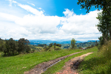 Naklejka na ściany i meble Beautiful road with mountains in the background. Cogua, Cundinamarca