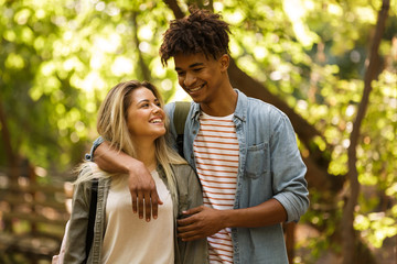 Obraz premium Cheerful young multiethnic couple spending time together