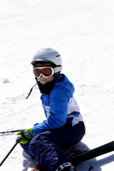 Fototapeta na wymiar Young boy is enjoying skiing