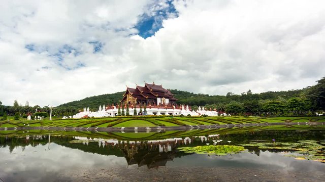 Time lapse video Royal Park Rajapruek Popular places of attraction in Chiang Mai with  reflecton and movement clouds backgroud.