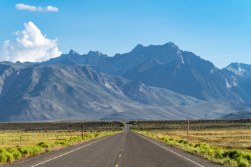 Long lonely road heading into the Eastern Sierra Nevada Mountains of California. Benton Crossing...