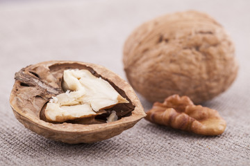 Walnuts on textile background close up group