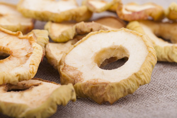 Dried apple slices on textile background