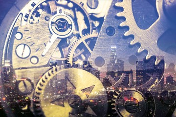Close-up photo of metal clock on city background