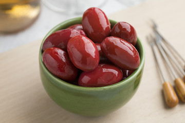 Bowl with red Italan Bella di cerignola olives