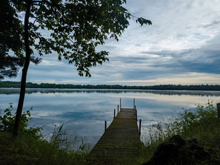Wooden dock on the calm lake