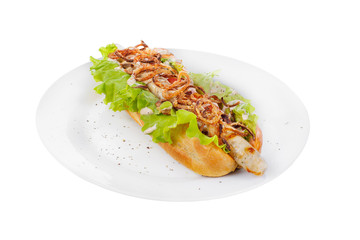 Hot dog with chicken, fish sausage, fried onions, lettuce, tomato and pepper on a plate, side view. Serving for a cafe, a restaurant in the menu. Isolated, white background