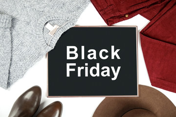 Black Friday promotion banner concept. Autumn clothing essentials for fashion boutique look book showcase. Casual set of matching garment items. Background, close up, top view, flat lay.