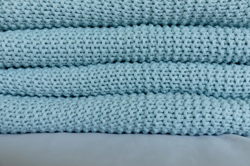 Warm and cozy Handmade blue knitted blankets, texture background
