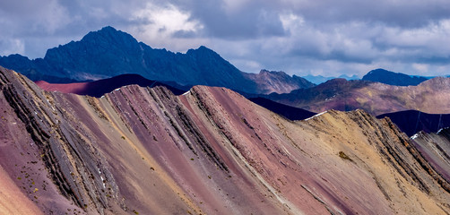 Colorful Mountains in the Andes with Cumulus Clouds