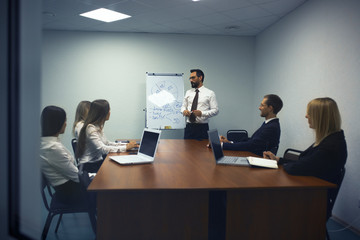 Work team in conference room having presentation of new business product. Business concept.
