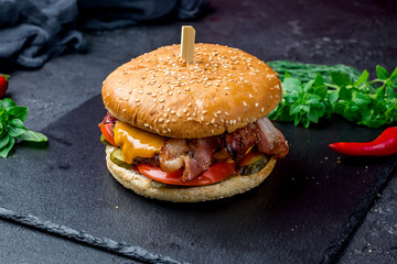 Burger with meat cheese and bacon