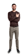 Fototapeta premium A bearded man in casual clothes smiles with his arms folded but still indicating sideways with his index finger.
