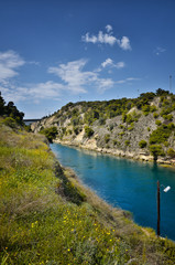 Fototapeta na wymiar Corinth Canal, tidal waterway across the Isthmus of Corinth in Greece, joining the Gulf of Corinth with the Saronic Gulf