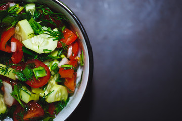 Close up salad of fresh tomatoes and cucumbers. Healthy food, vegetables.