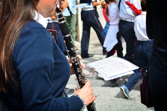 Street musicians play folk music at city square.