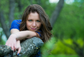 Beautiful young girl walking in spring Park