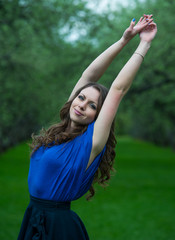 Beautiful young girl walking in spring Park