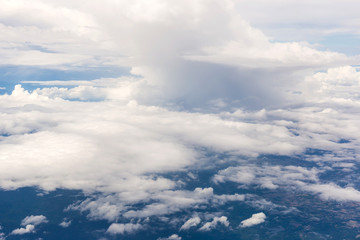 Obraz na płótnie Canvas clouds and blue sky seen from plane