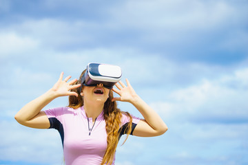 Woman wearing VR outside