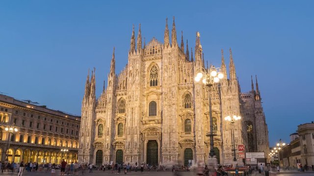 Milan Italy time lapse 4K, city skyline day to night timelapse at Milano Duomo Cathedral