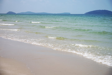 Fototapeta na wymiar Tropical sea landscape with white sand and blue sea. Tropical seaside landscape with white sand beach