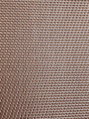 Close up of dinner place setting mat looking like an abstract metallic pattern