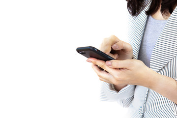 Asian business women in the white suit are using a smartphone.