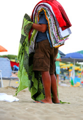 elderly peddler with towel and clothes