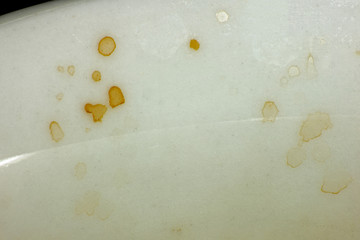 Spots of coffee on a white cup is macro