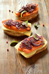 Bruschetta with roasted pumpkin, cheese and fried onions